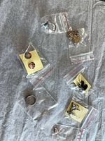 All jewelry pieces bagged on fabric background