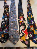 All four Disney ties laid out side by side