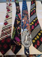 All four neckties laid flat showing patterns