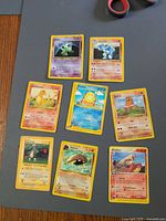 All eight Pokémon cards laid out on table