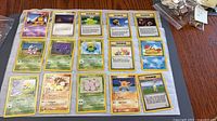 Overview of all 15 Pokémon cards laid in three rows of five
