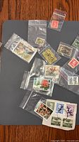 Overview of multiple bagged stamps on tabletop