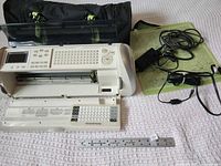 Cricut Expression machine, bag, mat, cords, ruler for scale