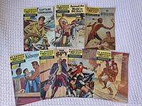 All seven comics laid out for overall view