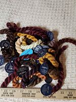 Pile of tagged silk skeins