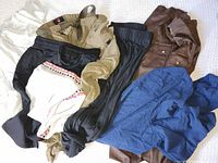 Mixed pile of various shorts and pants