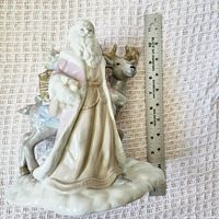 Full view of Santa and reindeer figurine beside ruler showing height
