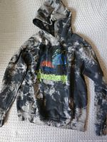 Front view of tie-dyed Goosebumps hoodie laid flat