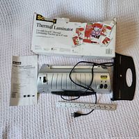 Laminator, power cord, measuring tape, original box