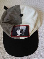 Front view of corduroy cap showing patch and color-blocked crown