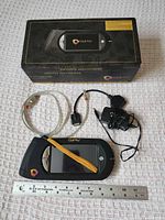 Cricut Gypsy device, USB cable, power adapter, box, and ruler for scale