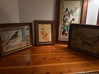 Overview of all four framed prints on table