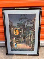 Full view of framed Koitsu print against red background