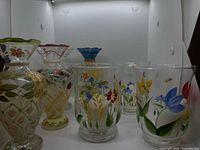 Four signed Tracy Porter vases and three hand-painted votive holders