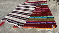 Both Mexican throws laid out showing full patterns and fringe