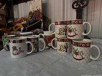 Group of holiday and Schnauzer mugs showing quantity and assorted designs