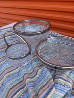 Three cut glass pieces showing sizes and rims