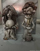 Both Bevilacqua ceramic figurines front view