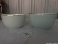 Two bowls side by side showing size difference and exterior color