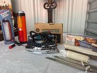 All three vintage GE items with their boxes displayed together