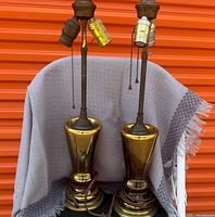 Full view of both gold mercury glass lamps standing side by side