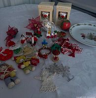 Group shot of all ornaments, plate and boxed items on table