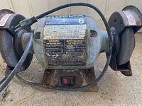 Front view showing Delta label and specs on 6" bench grinder