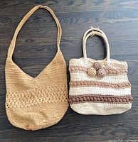 Both purses side by side showing overall styles and sizes