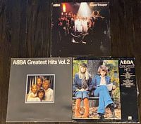 Three ABBA albums: Super Trouper (top), Greatest Hits Vol. 2 (bottom left), Greatest Hits (bottom right)