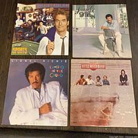 All four album covers laid out