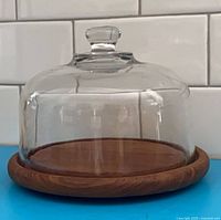 Teak cheese board with glass cloche assembled