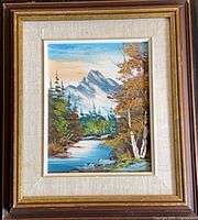 Full view of framed mountain landscape painting