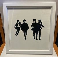 Front view showing black silhouette image of The Beatles in white square frame