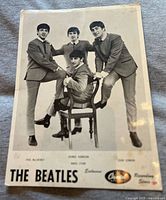 Front of original Capitol Records promotional photograph of The Beatles