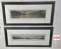 Both framed George Raab prints on wall