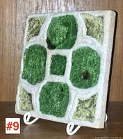 Angled front view of the ceramic tile showing overall design and texture