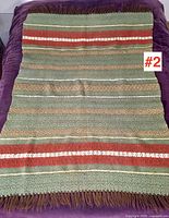 Full view of wool blanket showing pattern, fringe and overall size