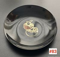 Top view of black Couroc bowl showing mushroom inlay