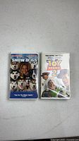 Front view of both VHS cases Snow Dogs and Toy Story 2