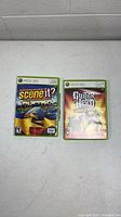 Closed cases of both Xbox 360 games front view