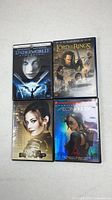 Front view of all four DVD cases: Underworld Evolution, The Lord of the Rings Return of the King, Razor Sharp, Aeon Flux