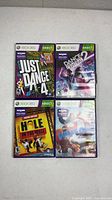 Front view of four Xbox 360 Kinect game cases