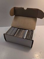 Closed white 550-count card storage box filled with cards