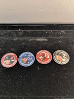 Front view of four NHL player coins