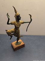 Full view of bronze dancing figure on base