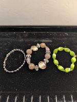 All three stretch bracelets arranged side by side