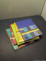 Stack of six sealed cardstock paper packs