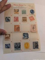 Full view of album sheet with 16 stamps