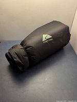 Rolled Ozark Trail camping mattress in carry sack