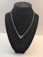 Full view of sterling silver necklace on display bust